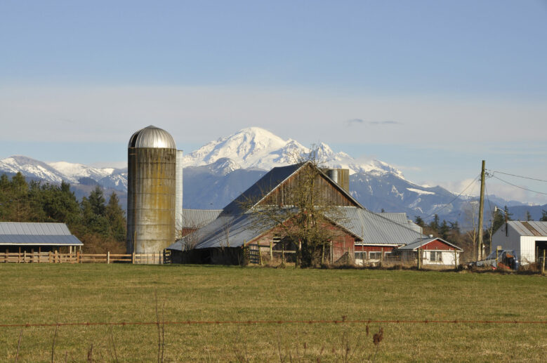 Farm house and barn with Mount Baker in the background